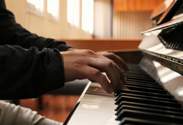Hands on piano keys